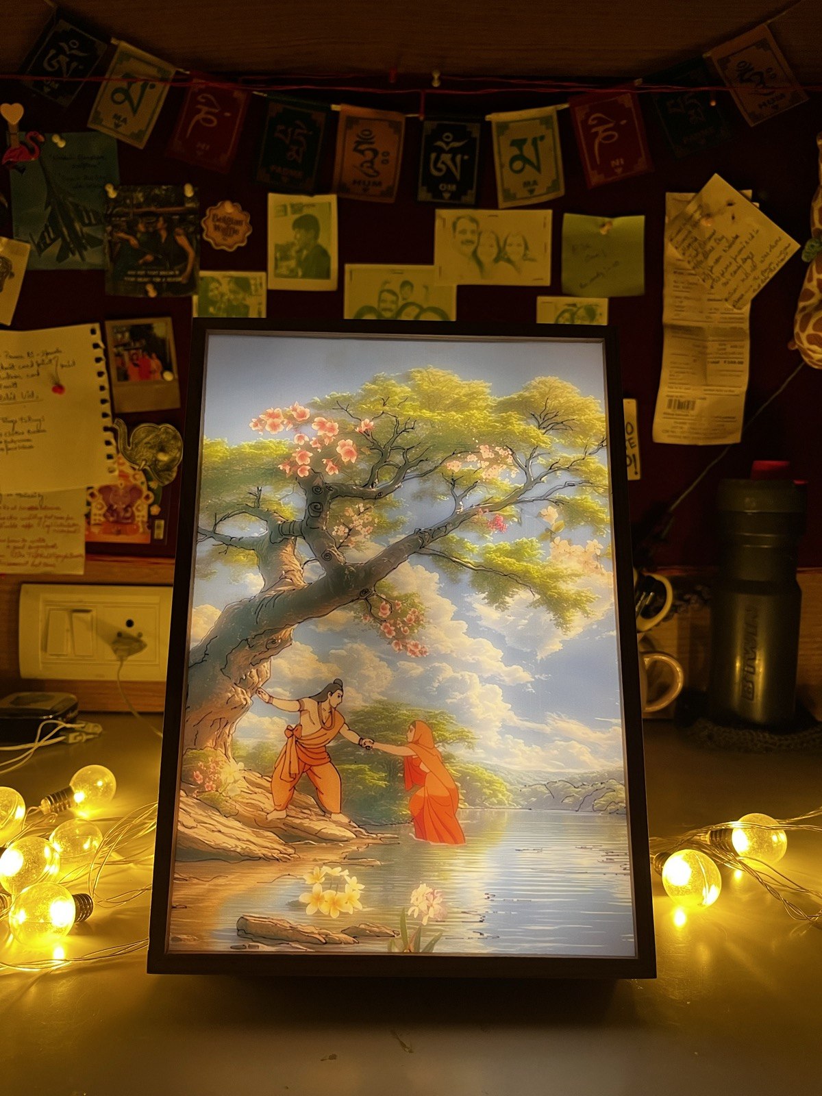 Ram–Sita light frame surrounded by warm room lights
